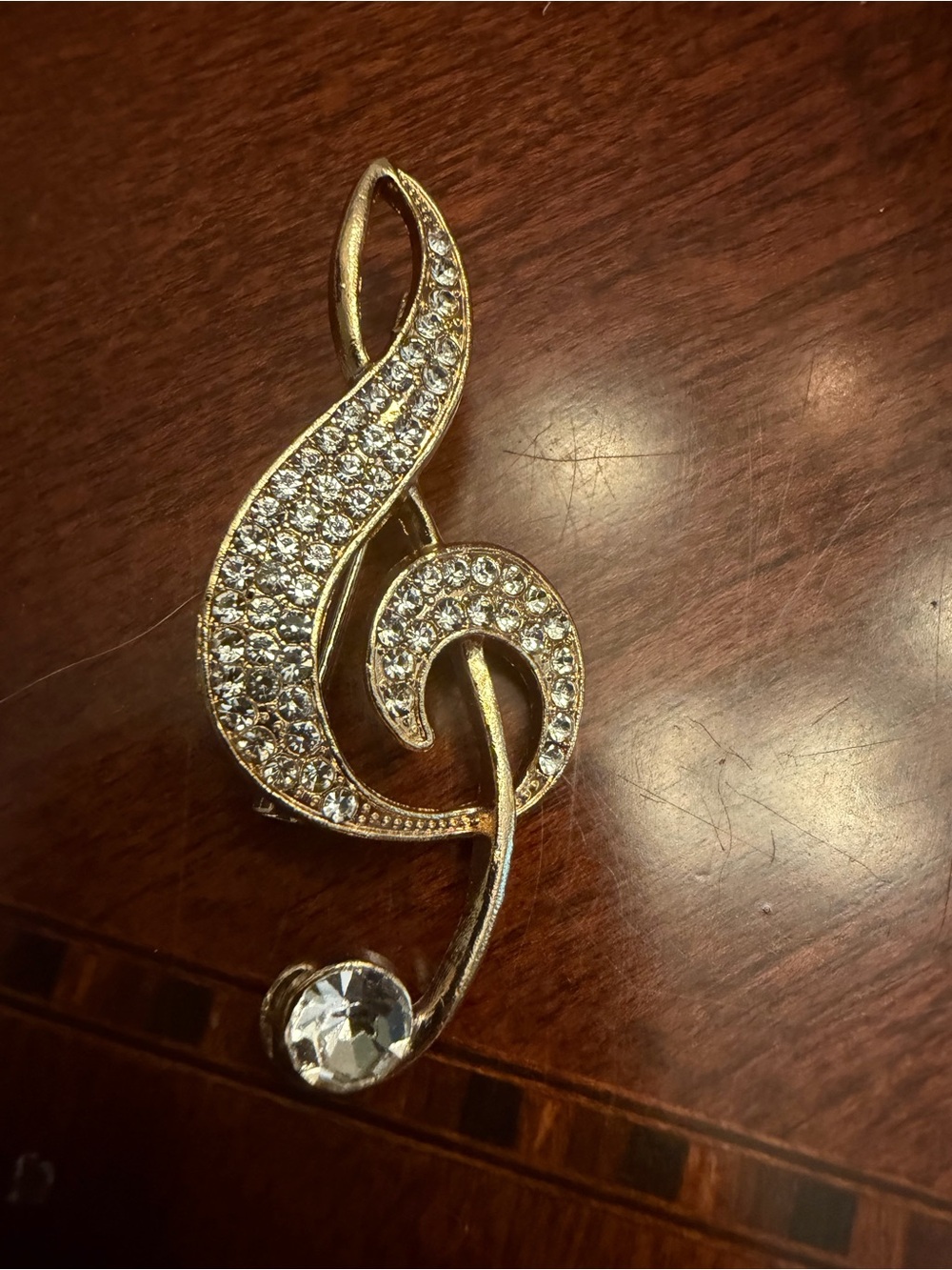 Gold-tone Treble Clef Brooch with Clear Rhinestones